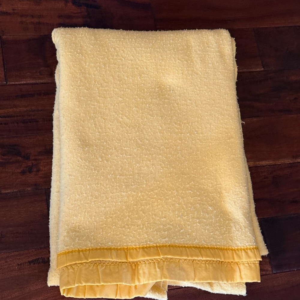 Vintage lemon yellow blanket with satin trim with wear
